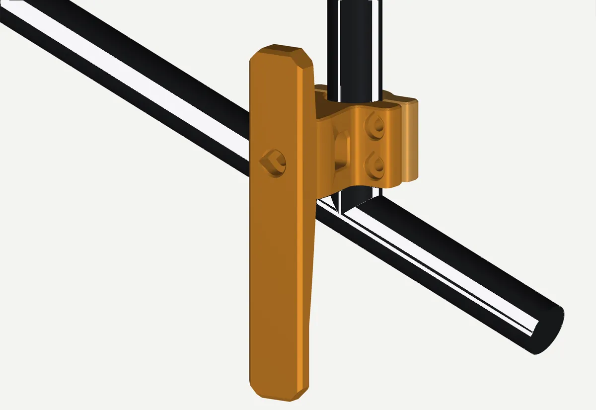 The anchor, highlighted in orange, clamped to a rack strut beside the rail