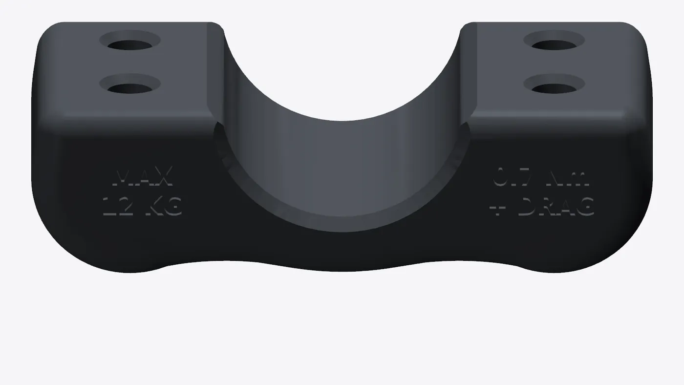 A clamp cap with four screw pockets and engraved torque guidance