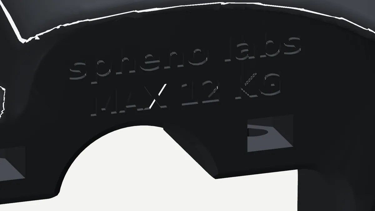 Engraved spheno labs wordmark and MAX 12 KG on the v13 clamp